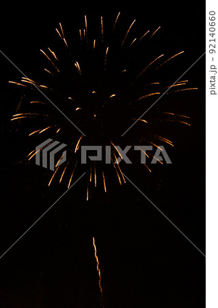 Fireworks exploding against black background Fireworks exploding against black background 92140660