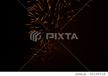 Fireworks exploding against black background Fireworks exploding against black background 92140719