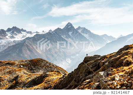 Amazing view on Monte Bianco mountains range with tourist on a foreground Amazing view on Monte Bianco mountains range with tourist on a foreground 92141467