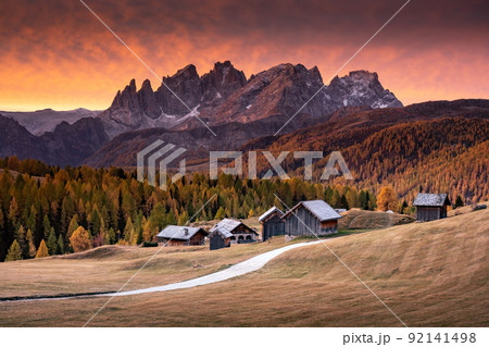 Incredible red sunset at Fuchiade valley in Italian Dolomites countryside 92141498