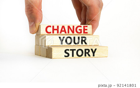 Change your story symbol. Concept words Change your story on wooden blocks on a beautiful white table white background. Businessman hand. Business finacial and change your story concept. Copy space. 92141801