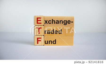 Concept words 'ETF, Exchange-Traded Fund' on cubes on a beautiful white background. Business concept. Copy space. Concept words 'ETF, Exchange-Traded Fund' on cubes on a beautiful white background. Business concept. Copy space. 92141816