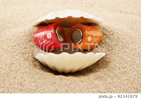 image of battery seashell sand background 92142879