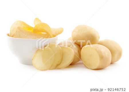 crispy chips and raw potato on white background crispy chips and raw potato on white background 92146752