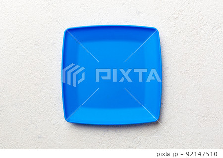 Top view of empty square plate on cement background. Empty space for your design 92147510
