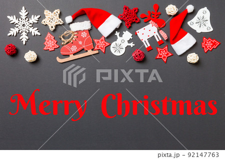 Merry Christmas text. New Year decorations on black background. Merry Christmas concept with empty space for your design 92147763
