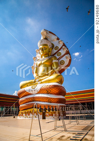Giant Buddhawith Naga serpent temple in Singburi, Thailand Giant Buddhawith Naga serpent temple in Singburi, Thailand 92149680