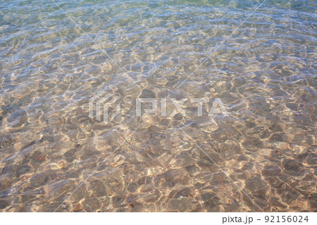 Seascape of clear water on the sea. Clear water on the ocean, sea or lake. Water ripples in the sun. 92156024