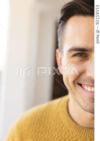 Vertical image of happy caucasian man looking at camera 92159553