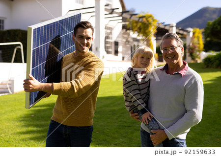 Image of caucasian father with solar panel, grandfather and grandson Image of caucasian father with solar panel, grandfather and grandson 92159633