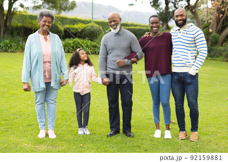 Image of happy multi generation african american family posing together outdoors Image of happy multi generation african american family posing together outdoors 92159881