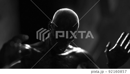 Image of human like monster in dark tunnel being stunned 92160857
