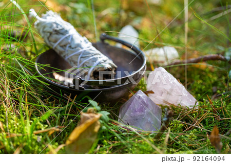 white sage in cup and magical crystals in forest white sage in cup and magical crystals in forest 92164094