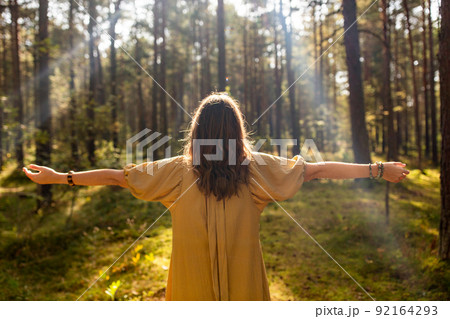 woman or witch performing magic ritual in forest woman or witch performing magic ritual in forest 92164293