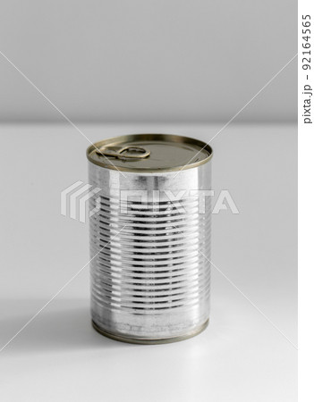 close up of tin can with preserved food on table close up of tin can with preserved food on table 92164565