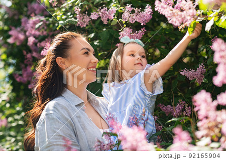 happy mother with little daughter at summer park 92165904