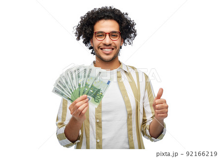 happy man with euro money showing thumbs up happy man with euro money showing thumbs up 92166219