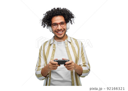 smiling man with gamepad playing video game smiling man with gamepad playing video game 92166321