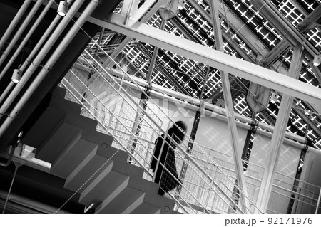 Unrecognizable person walking down steps 92171976