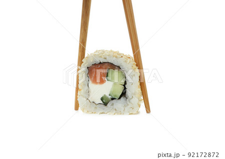 Chopsticks with roll isolated on white background Chopsticks with roll isolated on white background 92172872