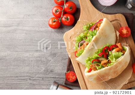 Concept of tasty food with pitas with chicken, space for text 92172901