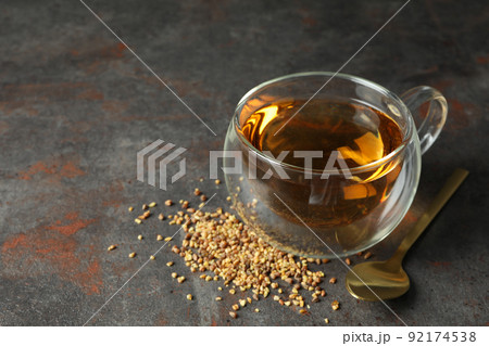 Concept of hot drink with buckwheat tea on dark textured background 92174538