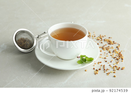 Concept of hot drink with buckwheat tea on light textured background 92174539