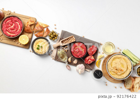 Concept of tasty food with hummus on white background 92176422