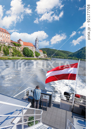 Panorama of Wachau valley (Unesco world heritage site) with ship on Danube river against Durnstein village in Lower Austria, Austria 92177708