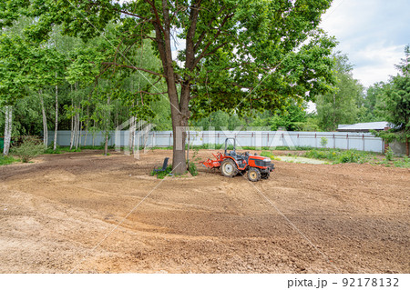 Minitractor on plowed and cultivated land 92178132