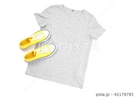 Blank t-shirt and sneakers isolated on white background Blank t-shirt and sneakers isolated on white background 92178785