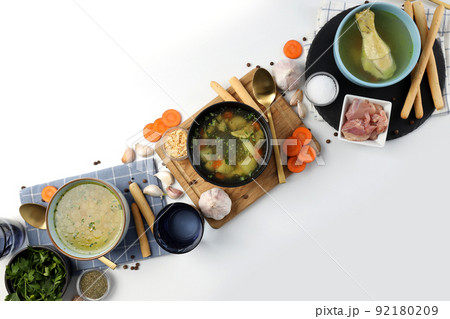Concept of cooking chicken soup or broth on white background Concept of cooking chicken soup or broth on white background 92180209