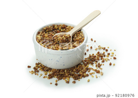Bowl with spoon and buckwheat tea isolated on white background 92180976