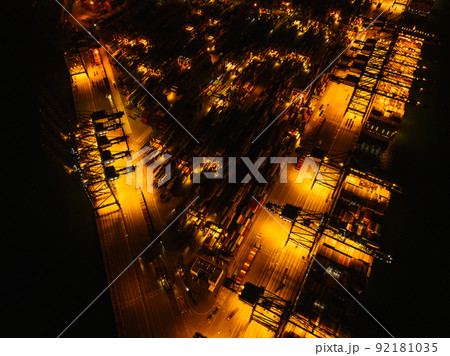 Aerial view of container terminal at night Aerial view of container terminal at night 92181035
