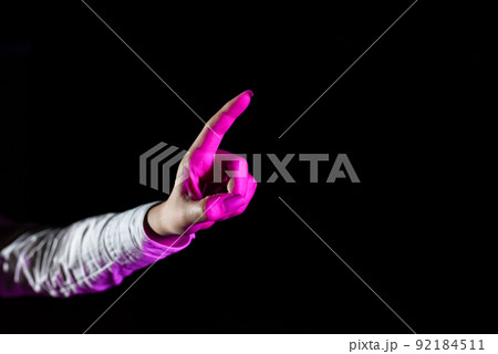 Hand Of Female Professional Pointing And Gesturing While Taking Training Through Virtual Reality Simulator. Light Falling On Woman Finger Presenting Futuristic Technology. Hand Of Female Professional Pointing And Gesturing While Taking Training Through Virtual Reality Simulator. Light Falling On Woman Finger Presenting Futuristic Technology. 92184511