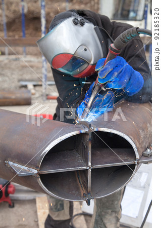 Welding process of metal products at the construction site 92185320