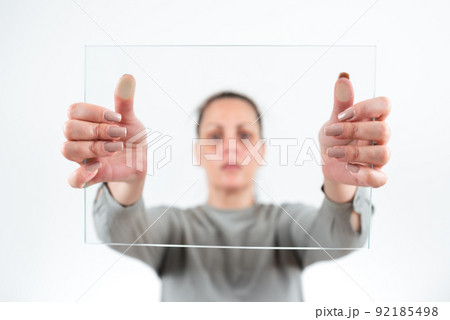 Female Professional Holding Transparent Glass And Displaying Important Data. Woman Wearing Smart Casual Showing Banner While Promoting The Business For Progress. 92185498