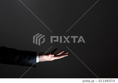 One Hand Holding Important Infortmations. Palm Presenting Crutial Announcements. Man In Suit Showing Recent Updates. Executive Displaying Critical Messages. 92186054