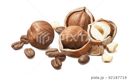 Hazelnuts and roasted coffee beans isolated on white background 92187719