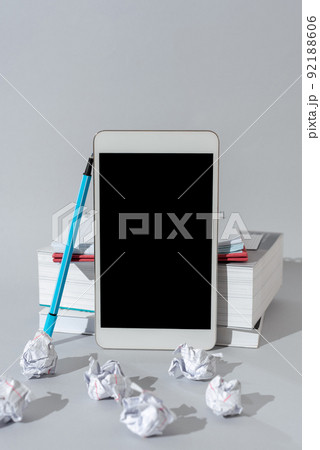 Important Messages Presented On Mobile Phone Leaning On Books And Notebook. Crutial Informations Displayed On Cellphone Screen On Desk With Pen And Paperwraps. Important Messages Presented On Mobile Phone Leaning On Books And Notebook. Crutial Informations Displayed On Cellphone Screen On Desk With Pen And Paperwraps. 92188606
