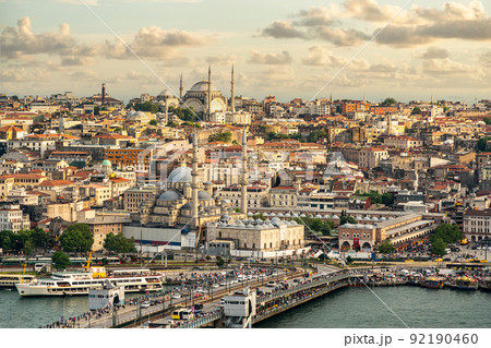 Istanbul skyline at sunset, Turkey. Aerial panoramic view of Galata bridge, Golden Horn and old Fatih district Istanbul skyline at sunset, Turkey. Aerial panoramic view of Galata bridge, Golden Horn and old Fatih district 92190460