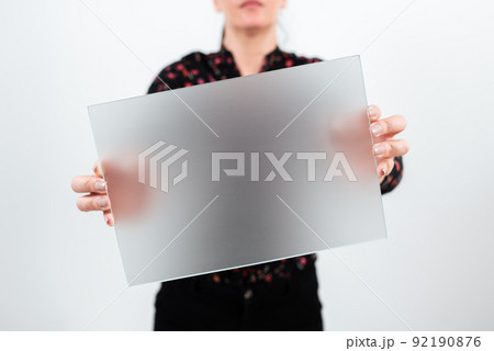 Businesswoman Holding Blank Placard And Making Important Announcement. Woman With Rectangular Board In Hands Presenting New Ideas For Advertising The Business. Businesswoman Holding Blank Placard And Making Important Announcement. Woman With Rectangular Board In Hands Presenting New Ideas For Advertising The Business. 92190876