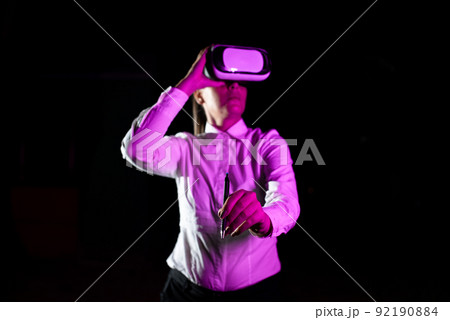 Female Manager Wearing Virtual Reality Headset Holding Pet While Taking Professional Training. Light Falling On Woman Using Gadget And Presenting Futuristic Technology. Female Manager Wearing Virtual Reality Headset Holding Pet While Taking Professional Training. Light Falling On Woman Using Gadget And Presenting Futuristic Technology. 92190884