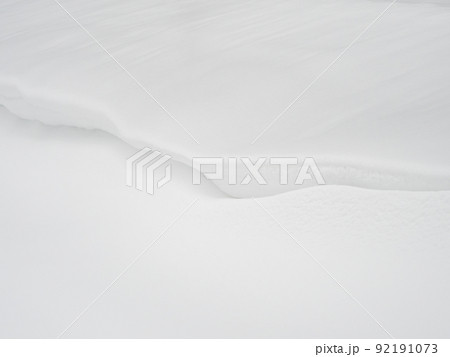 Snow drifts background, a large amount of fallen snow. White clean snow texture. 92191073