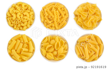 Raw italian pasta in ceramic bowl isolated on white background. Top view. Flat lay. Set or collection 92191619