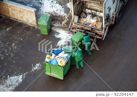 Garbage men collecting mixed household waste for separating and recycling, Moscow, 27.01.2020 Garbage men collecting mixed household waste for separating and recycling, Moscow, 27.01.2020 92204347