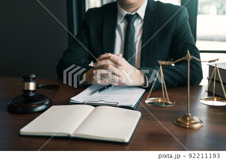 Justice and law concept with male lawyer in the office. Justice and law concept with male lawyer in the office. 92211193