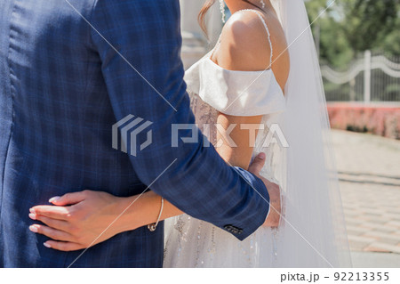 bride and groom together in park at the wedding bride and groom together in park at the wedding 92213355