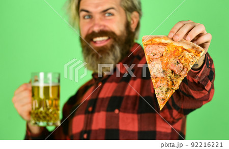 watching football on TV. fast food. happy bearded man watching football on TV. fast food. happy bearded man 92216221