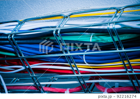 Ethernet cables in a cable guard leading along the ceiling inside server room Ethernet cables in a cable guard leading along the ceiling inside server room 92216274